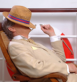 Michael Lunts as Noel Coward